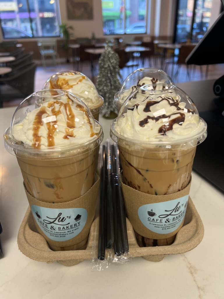 Flight of iced lattes with caramel and chocolate drizzle at Lu's