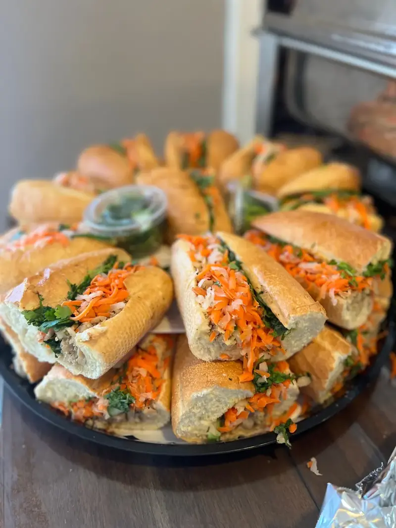 Bánh mì catering tray with pickled carrots and cilantro from Lu's Cafe & Bakery