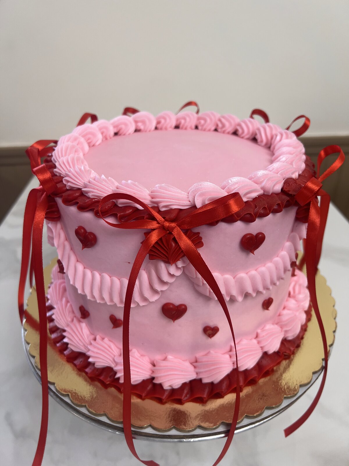 Valentine's tiered heart cake with ribbon at Lu's