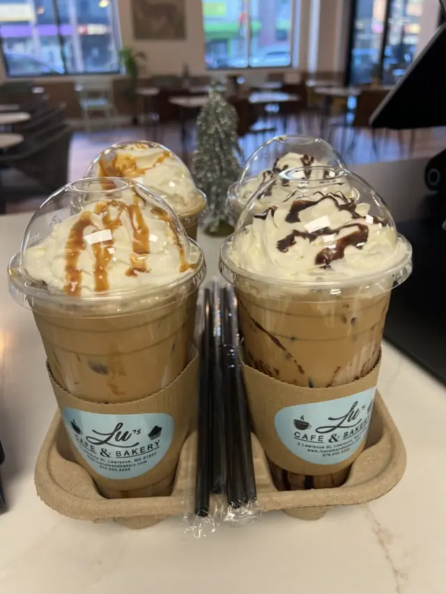 Flight of iced lattes with caramel and chocolate drizzle at Lu's