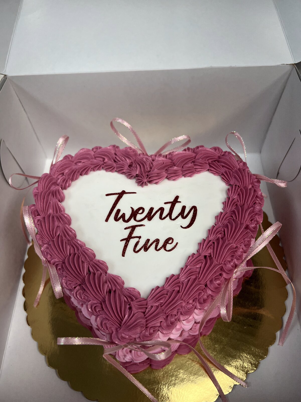 Heart-shaped ombre pink birthday cake at Lu's
