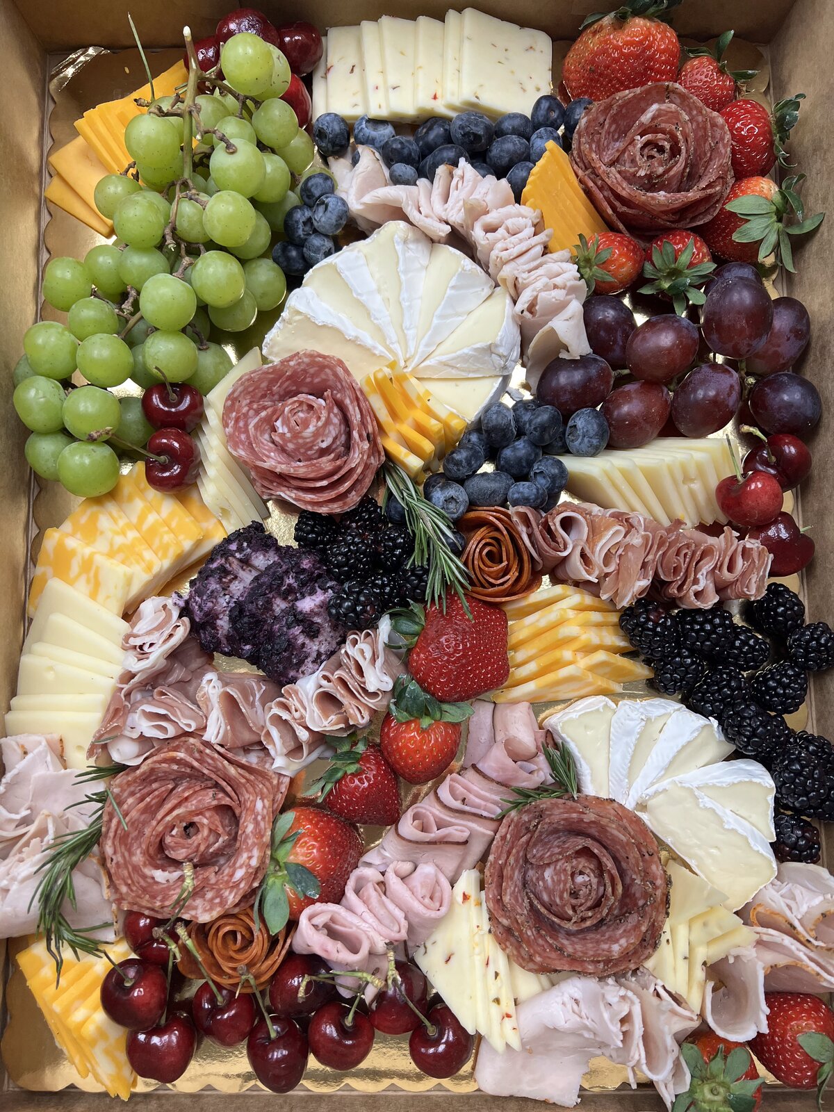 Charcuterie board with berries & cherries
