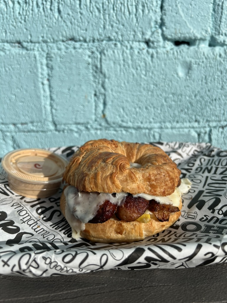 Bacon, egg, and cheese croissant breakfast sandwich at Lu's Cafe & Bakery